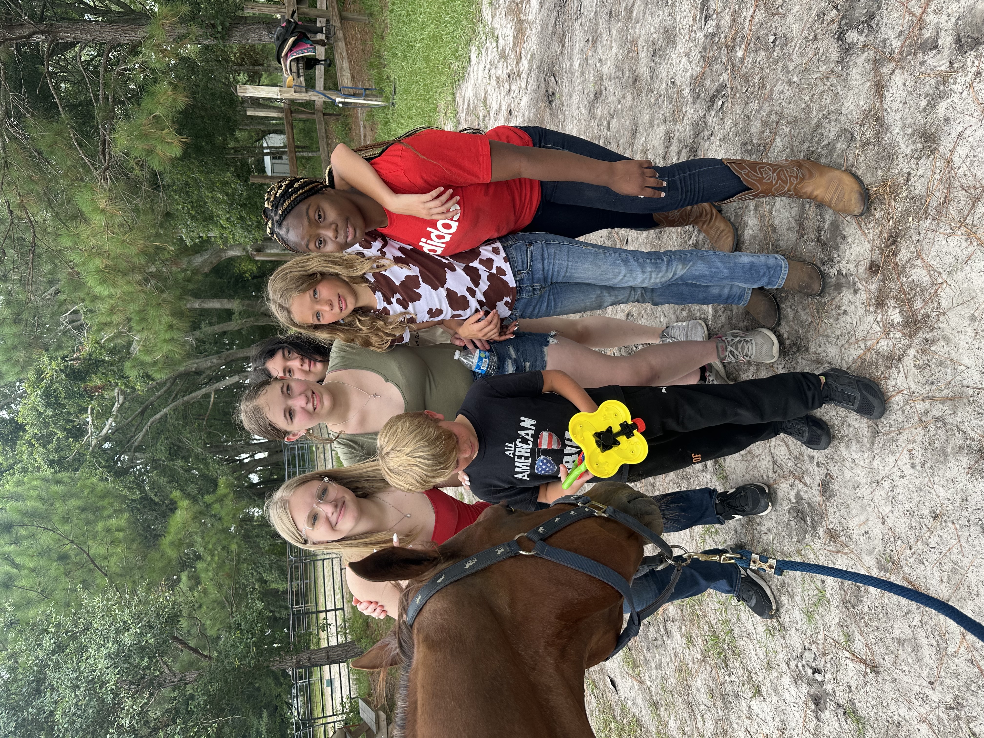 Group enjoying horses at StoneCrest Stable
